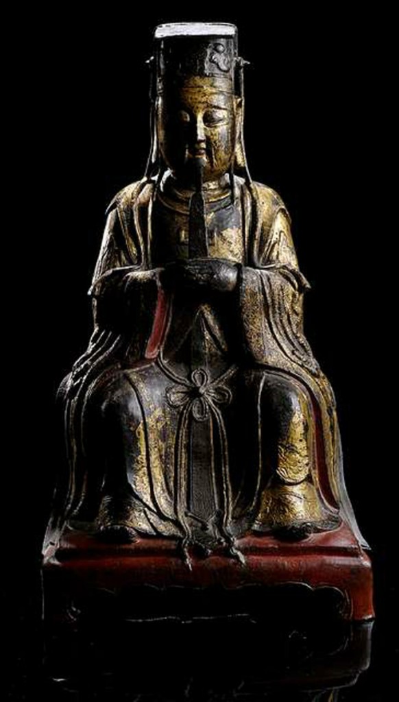 MING DYNASTY, GILT, RED AND BLACK LACQUERED BRONZE FIGURE OF DIGNITARY