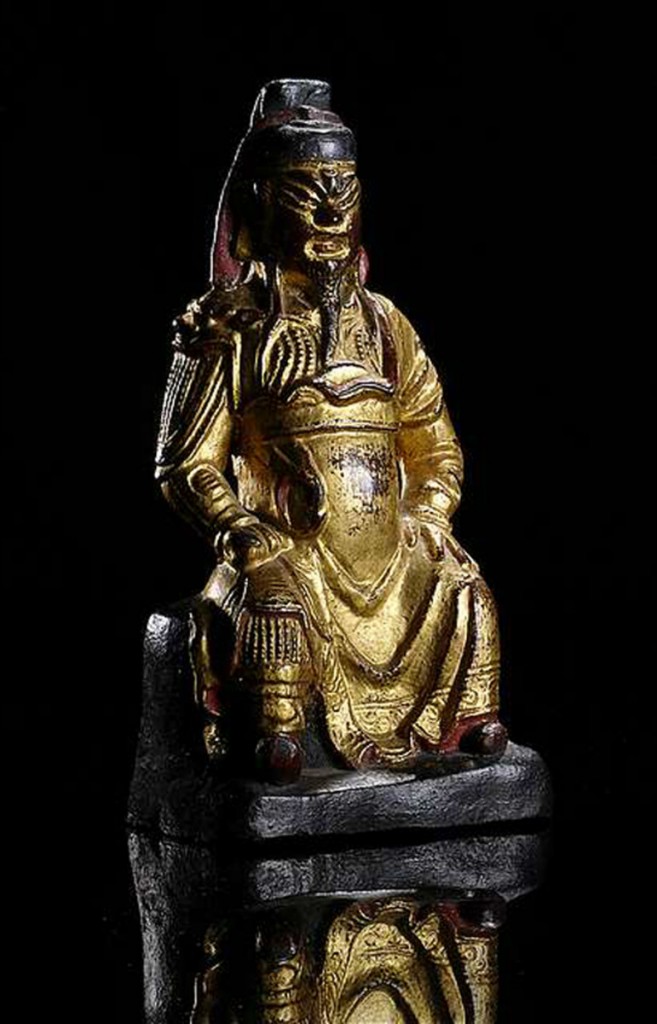 MING DYNASTY, GILT, RED AND BLACK LACQUERED BRONZE FIGURE OF GUANDI